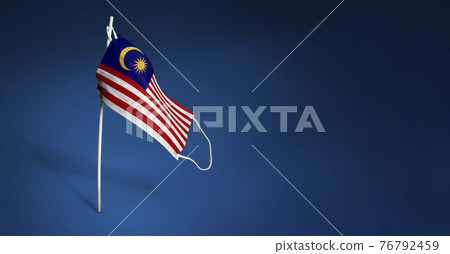 Malaysia mask on dark blue background. Waving flag of Malaysia painted on medical mask on pole. Concept of The banner of the fight against the epidemic coronavirus COVID-19. Copy space Malaysia mask on dark blue background. Waving flag of Malaysia painted on medical mask on pole. Concept of The banner of the fight against the epidemic coronavirus COVID-19. Copy space 76792459