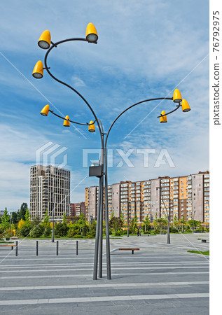 Street LED lamp in courtyard of multi-storey buildings Street LED lamp in courtyard of multi-storey buildings 76792975