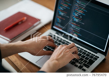 Image of male hand / system engineer to program 76795470