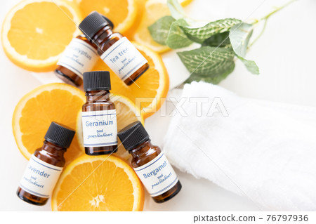 Aroma oil bottle and fruit (orange and lemon) Aroma oil bottle and fruit (orange and lemon) 76797936