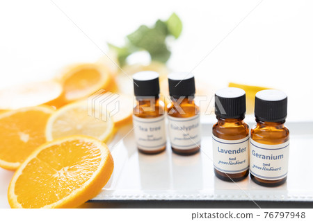 Aroma oil bottle and fruit (orange and lemon) Aroma oil bottle and fruit (orange and lemon) 76797948