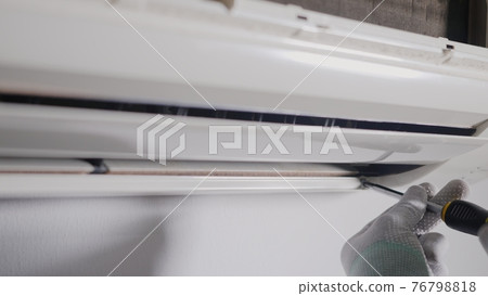 Technician service checking and repair air conditioner house indoors on the wall Technician service checking and repair air conditioner house indoors on the wall 76798818