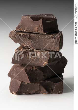 Stacked chocolate white background Stacked chocolate white background 76799868