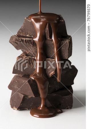 Sprinkle melted chocolate on a white background Sprinkle melted chocolate on a white background 76799870