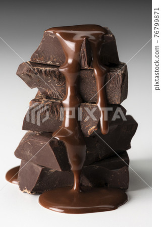 Sprinkle melted chocolate on a white background Sprinkle melted chocolate on a white background 76799871