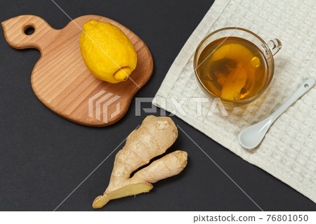 Health remedy foods for cold and flu relief on a black background. Health remedy foods for cold and flu relief on a black background. 76801050
