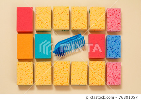 Sponges of different colors on a beige background. 76801057