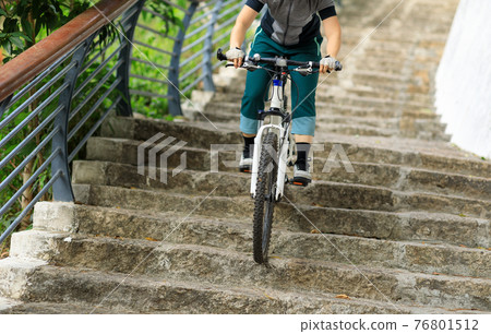 Successful woman looking at the view on high altitude mountain top 76801512