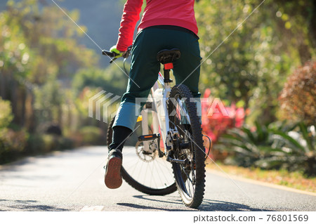 Successful woman looking at the view on high altitude mountain top 76801569