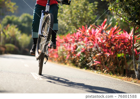 Successful woman looking at the view on high altitude mountain top 76801588