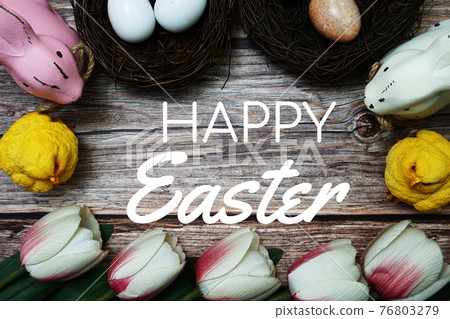 Happy Easter with flower, rabbit and easter eggs decoration on wooden background Happy Easter with flower, rabbit and easter eggs decoration on wooden background 76803279