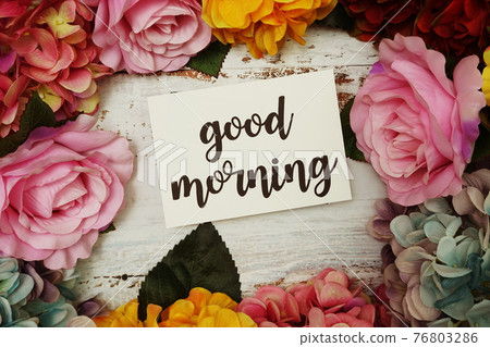 Good Morning Card with colorful flowers border frame on wooden background Good Morning Card with colorful flowers border frame on wooden background 76803286