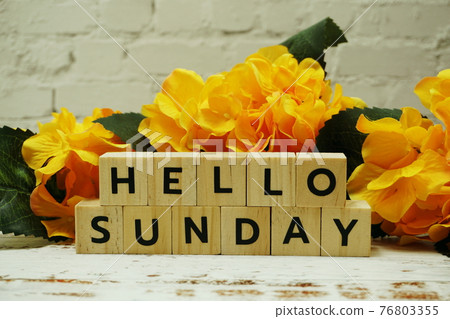 Hello Sunday alphabet letter on wooden background Hello Sunday alphabet letter on wooden background 76803355