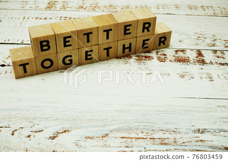 Better Together alphabet letter on wooden background 76803459