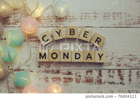 Cyber Monday alphabet letter and LED cotton balls on wooden background 76804121