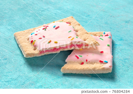 Pop tart, broken, on a blue background 76804284