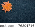orange gerbera flower on denim texture background. blank design in the style of hippie, boho, bohemia for cards, invitations, flyers. free space for your text 76804716