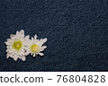 White gerbera flower on denim texture background. blank design in the style of hippie, boho, bohemia for cards, invitations, flyers. free space for your text 76804828