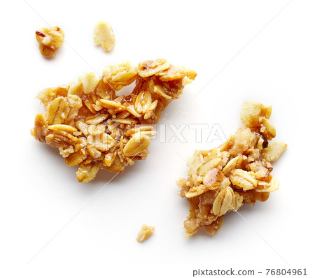 piece and crumbs of homemade granola 76804961