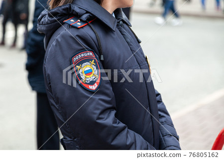 Russia Kemerovo 2019-05-10 Police employee in uniform patrolling public event 76805162