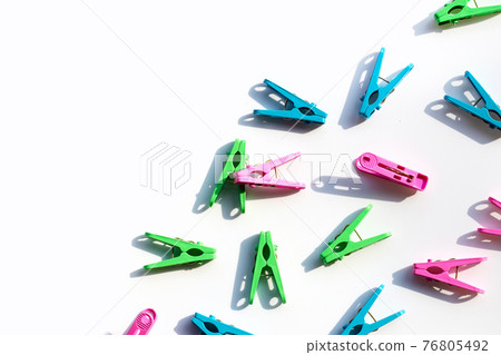 Plastic clothespin on white background. 76805492