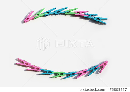 Plastic clothespin on white background. 76805557