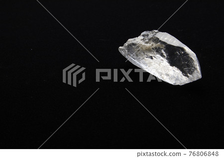 Beautiful crystal on black background 76806848
