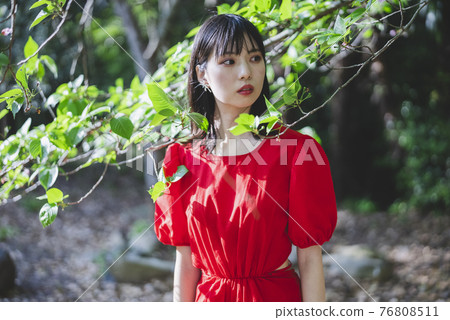 A woman in nature 76808511