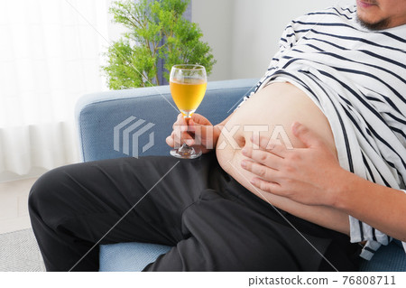 An obese man who drinks too much alcohol An obese man who drinks too much alcohol 76808711