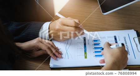 Fund managers researching and analysis Investment stock market. Business team consultation and discuss about analysis Investment stock market by paperwork. Fund managers researching and analysis Investment stock market. Business team consultation and discuss about analysis Investment stock market by paperwork. 76808994