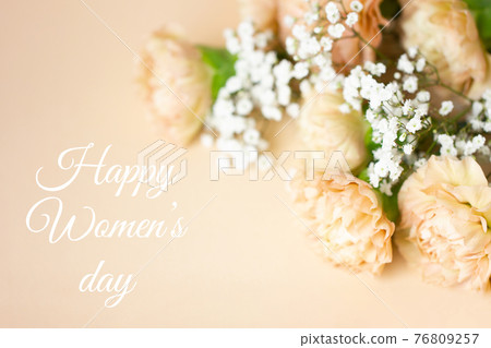 Beige carnation flowers bouquet on light beige background. Beige carnation flowers bouquet on light beige background. 76809257