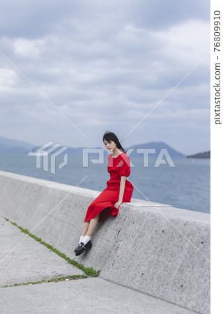 A woman on the coast A woman on the coast 76809910