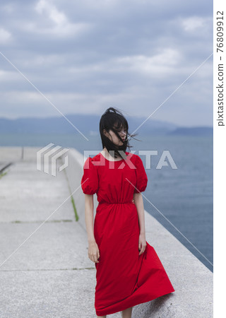 A woman on the coast A woman on the coast 76809912