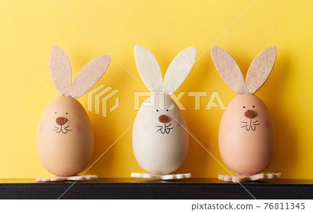 three bunny shaped easter eggs 76811345