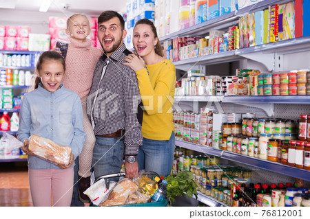parents with children holding full basket parents with children holding full basket 76812001