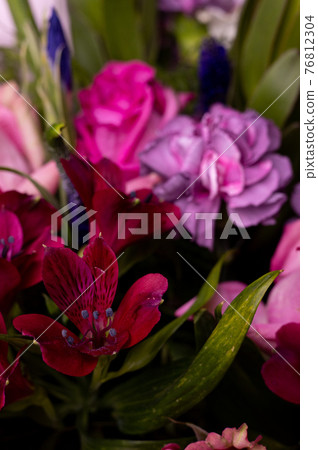 Bouquet of pink English roses, tulip, carnation and green close up vertical 76812304