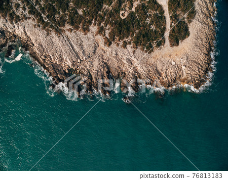 Big waves take over the incredible rocks of the Aegean Sea at Pelion Peninsula, Greece. Photo taken whit drone. 76813183