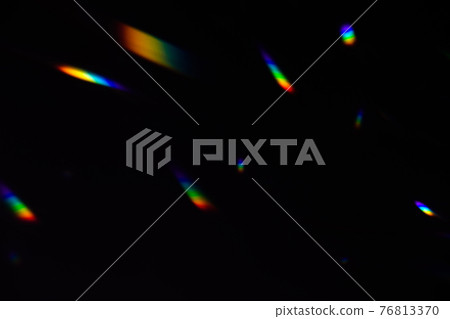 colorful warm rainbow crystal light leaks on black background 76813370