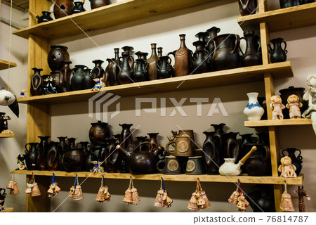 Handycraft clay brown tableware, earthenware jug in pottery workshop. Ceramics product concept. 76814787