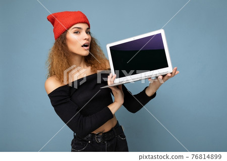Beautiful amazed surprised shocked asking thoughtful young brunette curly woman with open mouth Beautiful amazed surprised shocked asking thoughtful young brunette curly woman with open mouth 76814899