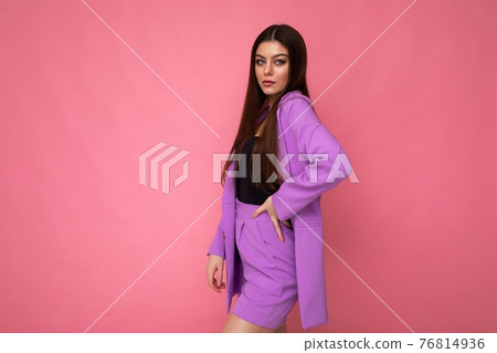 Young brunette woman nice-looking attractive charming elegant fashionable serious isolated over pink 76814936