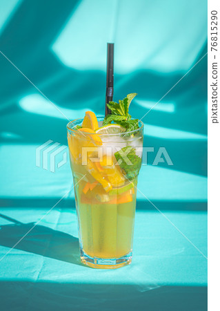 Glass of cold lemon ice tea Drink isolated on abstract blue background. 76815290
