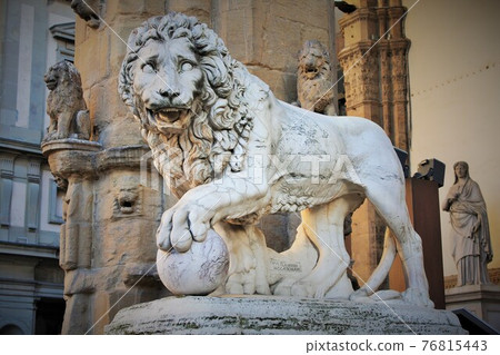 Florence, Tuscany, Italy: ancient statue of a lion in Piazza della Signoria, sculpture that depicts a lion with a sphere under one paw Florence, Tuscany, Italy: ancient statue of a lion in Piazza della Signoria, sculpture that depicts a lion with a sphere under one paw 76815443