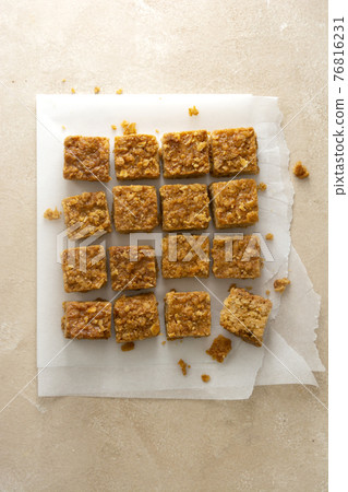 Energy bites, fudges oatmeal healthy snack, square cookies, top view Energy bites, fudges oatmeal healthy snack, square cookies, top view 76816231