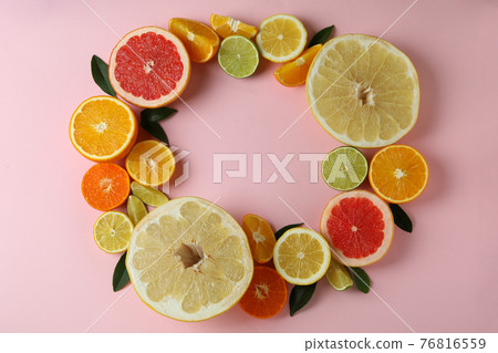 Ripe citrus on pink background, space for text 76816559