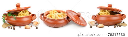 Spaghetti and spices in a ceramic saucepan isolated on white Spaghetti and spices in a ceramic saucepan isolated on white 76817580