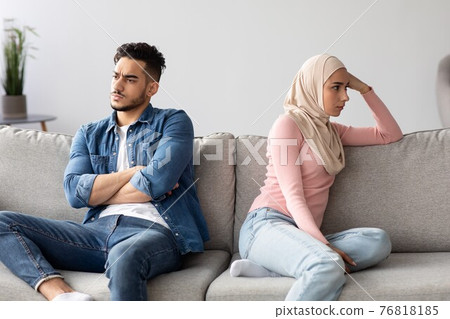 Angry muslim husband and wife having quarrel at home 76818185