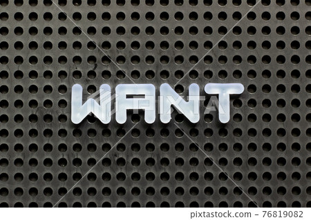 White color letter in word want on black pegboard background White color letter in word want on black pegboard background 76819082