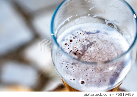 Light beer in a glass wine glass on a picnic on the nature 76819499