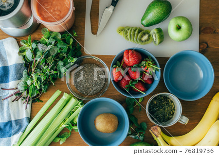 Summer food flatlay. Healthy eating. Fruit salad. Blender with ready-made smoothies. Summer food flatlay. Healthy eating. Fruit salad. Blender with ready-made smoothies. 76819736